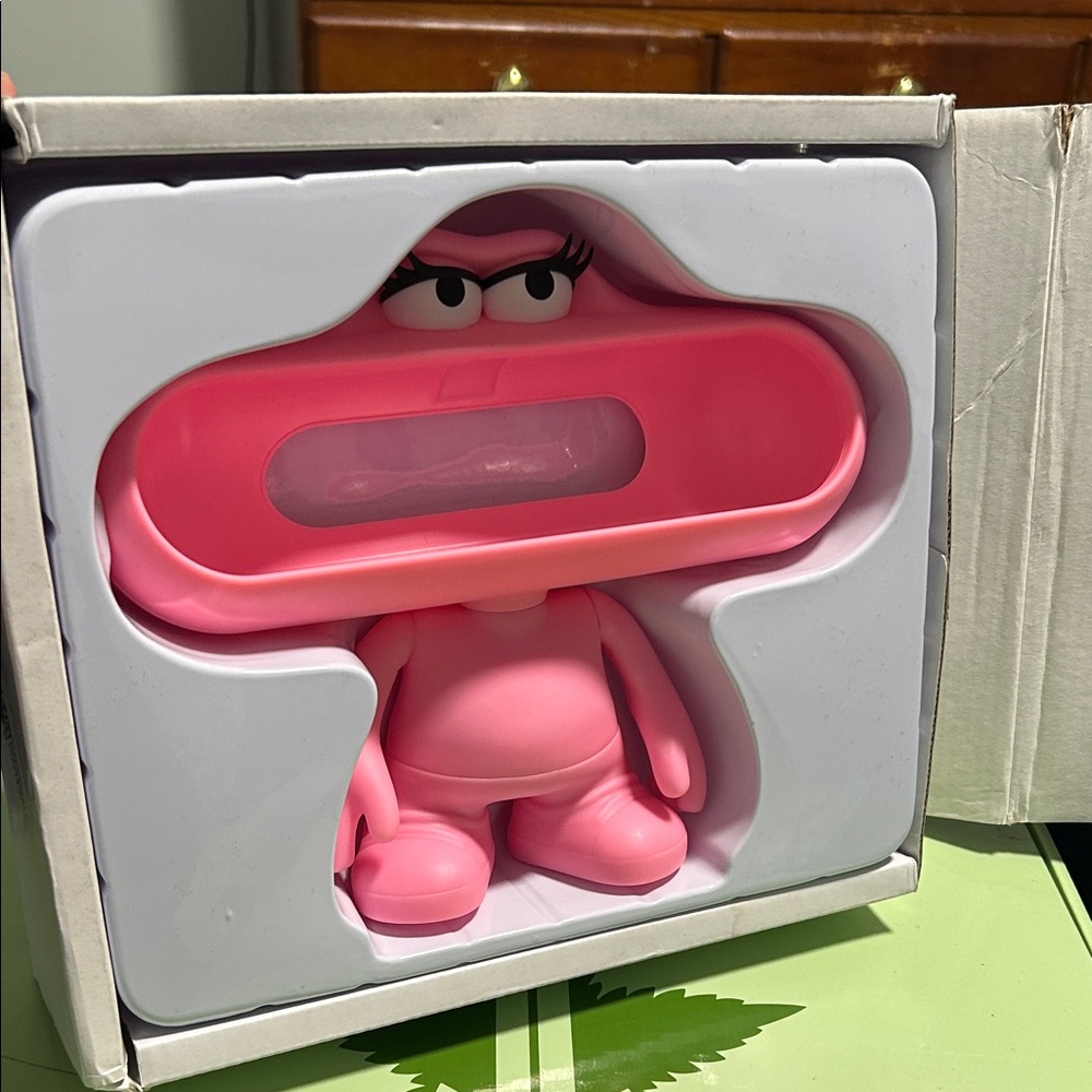 Pink Character Lipstick Pill Beats holder.